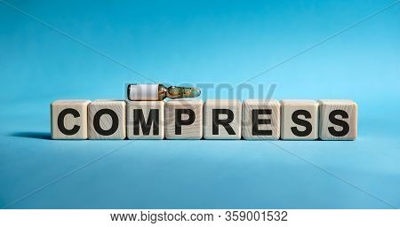 Compress- Text On Cubes. Drug In Ambula To Reduce Disease Symptoms On A Blue Background