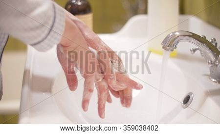 Woman Scrupulously Washing Her Hands