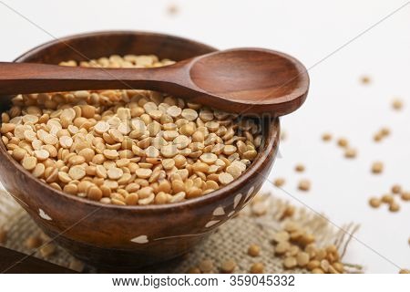 Pigeon Pea Also Known As Toor Dal In Wooden Bowl And Spoon