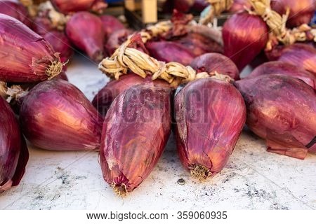 Red Onions From Tropea (cipolla Rossa Di Tropea) At A Farmers Market In Italy
