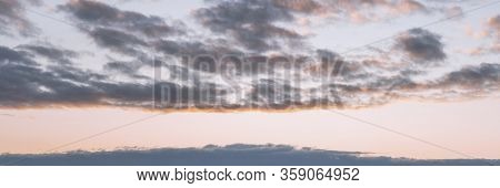 Evening Sky At Sunset Background. Dark Clouds Hanging Above Horizon. Majestic Cloudscape In Blue, Or