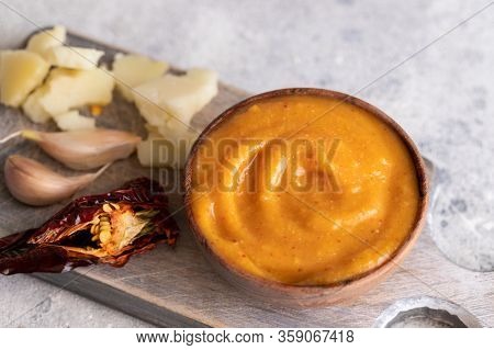 Almogrote , Cheese Paste Form La Gomera, Canary Islands In Wooden Bowl On Cut Board With Hard Goat C