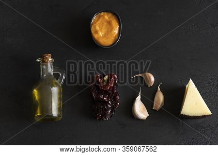 Almogrote , Cheese Paste With Their Ingredients Hard Cheese, Peppers, Olive Oil And Garlic On Black 