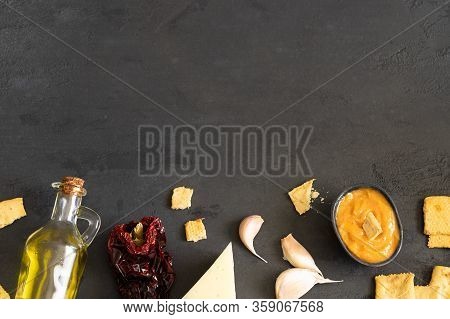 Almogrote , Cheese Paste With Their Ingredients Hard Cheese, Peppers, Olive Oil And Garlic On Black 