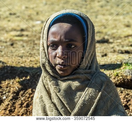 Gondar, Ethiopia - Feb 07, 2020: Agricultural Population Working On The Farms Between Gondar And The