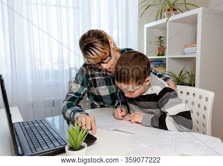 Young Women Working From Home With Child. Homeschooling, Freelance Job