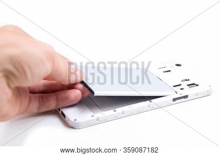 The Process Of Replacing The Battery In A Cell Phone.