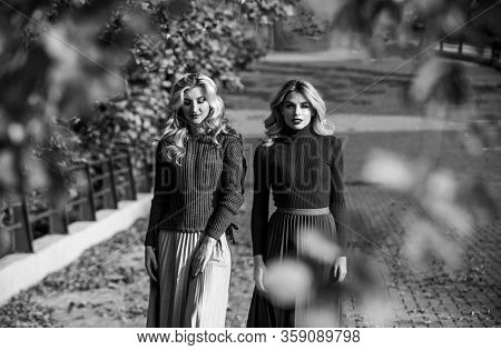 Forest Foliage. Sunny Day With Fallen Leaves. Fall Fashion Season. Pleated Trend. Girls In Corrugate
