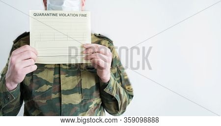 Police Officer With Handcuffs In Khaki Colored Uniform Stops People On The Street For Violating Rule