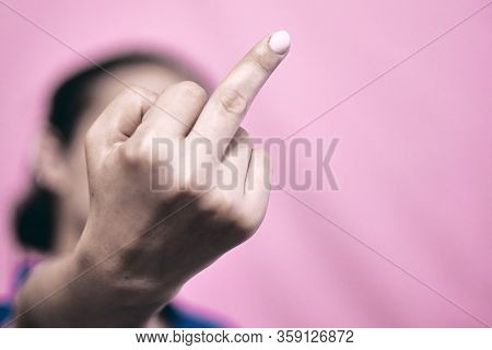 Rude Feminist Showing Middle Finger. Fuck You Or Fuck Covid-19 Symbol
