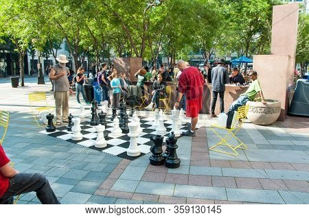 Seattle, Wa Usa August 23, 2014:  People Enjoy The Giant Outdoor Chess Game In Occidental Park In Pi