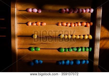Assorted Bean Candies Making On Wooden Sufrace Colorful Abacus, Fun Way To Learn Numbers For A Kid