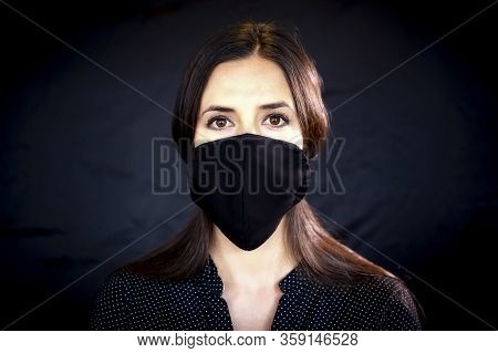 Young Woman Wearing A Protective Black Leather Face Mask During The Coronavirus Disease Covid-19 Out