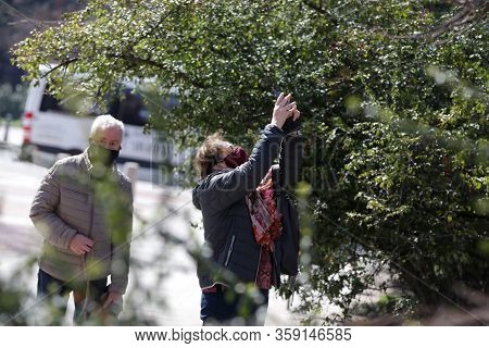 Sofia, Bulgaria - 30 March, 2020: A Woman And A Man Wearing Multiple Use Protective Face Masks Durin