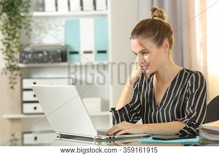 Young Self Employed Working Using A Laptop At Homeoffice