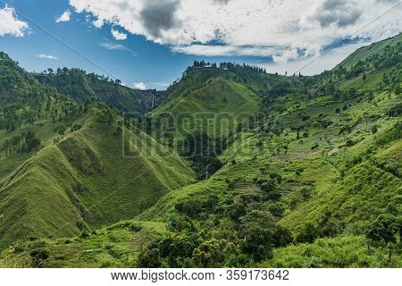 Amazing Green Lake Toba Tall Slopes With Sipiso Piso Waterfall Far Away