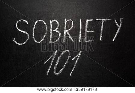 Sobriety 101 Written In White Chalk On A Black Chalkboard.