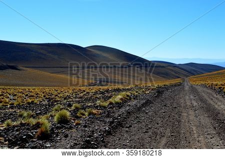 The Road And The Train Trucks Intertwined In The Pune Between Caipe And Socompa, Salta, Argentina
