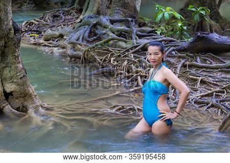 Woman Pretty In Swimsuit At Huai Mae Khamin Waterfall And Natural In Kanchanaburi Province Thailand.