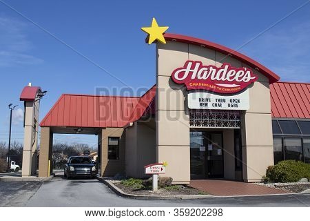 Indianapolis - Circa April 2020: Hardees Location. Hardees Is Offering Uber And Door Dash Delivery A