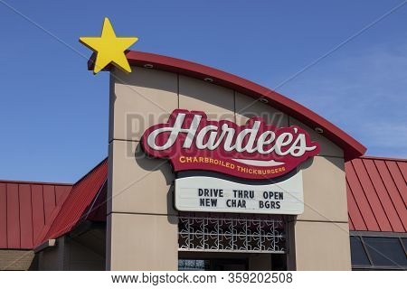 Indianapolis - Circa April 2020: Hardees Location. Hardees Is Offering Uber And Door Dash Delivery A