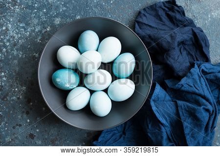 Blue Easter Eggs Painted With Natural Dye Red Cabbage On Dark Blue Concrete Background. Row Of Ombre