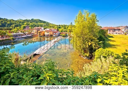 Mincio River Green Landscape And Idyllic Village Of Borghetto View, Veneto Region Of Northern Italy