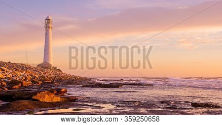 Slangkop Lighthouse Near The Town Of Kommetjie In Cape Town, South Africa