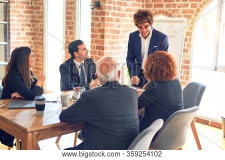 Group of business workers working together in a meeting. Listening one of them speaking at the office.