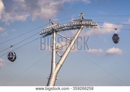 Cable Car And Pole Against Blue Sky With Clouds. Cable Car Connects Sparrow Hills (well Known As Vor