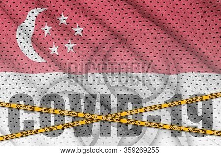 Singapore Flag And Covid-19 Inscription With Orange Quarantine Border Tape. Coronavirus Or 2019-ncov