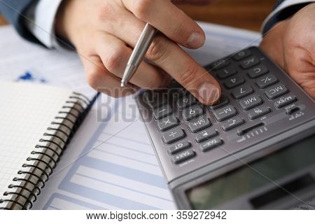 Man Analyzes Cost Renting, Counting On Calculator. Protection Contract When Appointing Consultants O