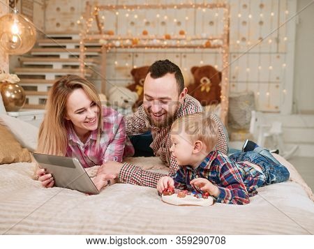 Stay At Home. Isolation Period. Happy Family. Watching Planchet Together. Quarantine