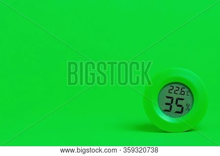 Hygrometer Measure Humidity On Green Color Background