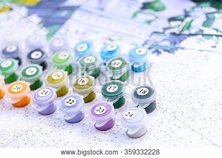 A Set Of Containers With Paints For Home Painting By Numbers. Hobby Painting Canvas.