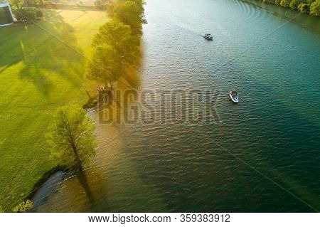 Sunset On The Lake Relaxing Boats And Relaxing Along The Coast Of Town Lake In Austin , Texas , Usa 