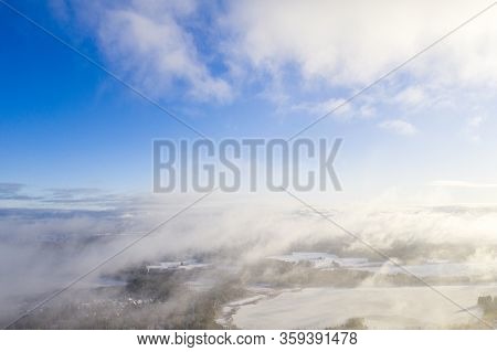 Aerial View Clouds Over Forest. Aerial View Of Forest And Clouds. Aerial Drone View Flying Over The