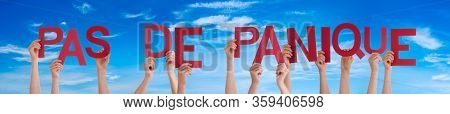 People Hands Holding Word Pas De Panique Means Do Not Panic, Blue Sky