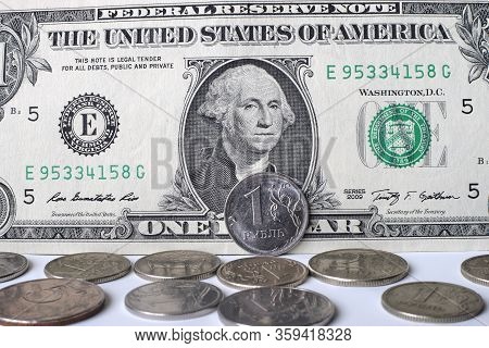 Coin Ruble On The Background Bills Dollar.
