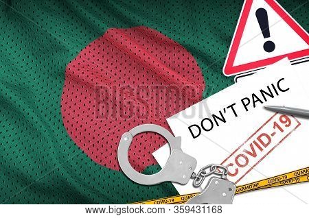 Bangladesh Flag And Police Handcuffs With Inscription Dont Panic On White Paper. Coronavirus Or 2019