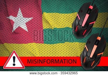 Togo Flag And Two Computer Mouses. Misinformation During Coronavirus Or 2019-ncov Virus Concept