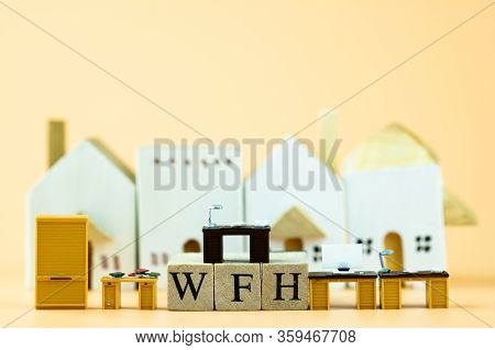 Miniature Office Table With Wood Block Text Of Wfh And Home Background. Concept Of Work From Home Du