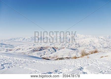 Beautiful Panoramic View Of Snow Covered Mountains. The Best View From The Beldersay Cable-way