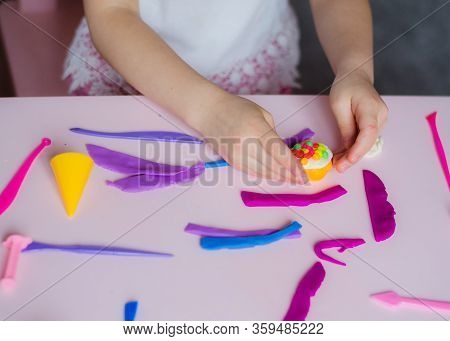 Child Hands Playing With Colorful Clay. Homemade Plastiline. Girl Molding Modeling Clay. Homemade Cl