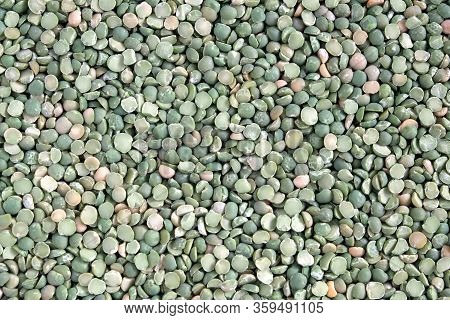 Food Supplies. Crop Of Many Dry Green Green Pease Grains On Flat Surface As Background Top View Clos