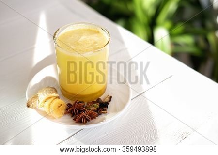 Traditional Indian Drink. Turmeric Milk Or Golden Milk With Cloves, Pepper, Cinnamon And Turmeric. G