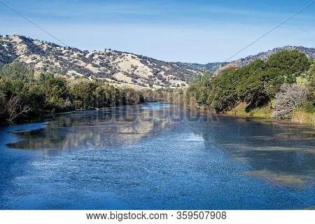 Panoramic View Of Lake Solano On A Autumn Day, Featuring Deep Blue Water And The Chaparral In The Ba