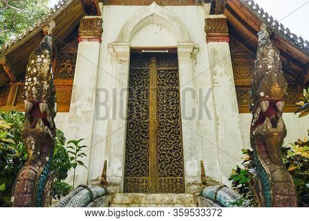 Wat Don Sak The Hidden Temple With An Iconic Wood Craving Door In Ayutthaya Period Located In Laplae