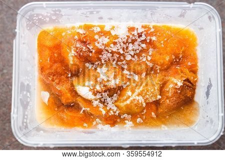 Preserving Fresh Produce, Frozen Apricots In Plastic Container With Ice On Top