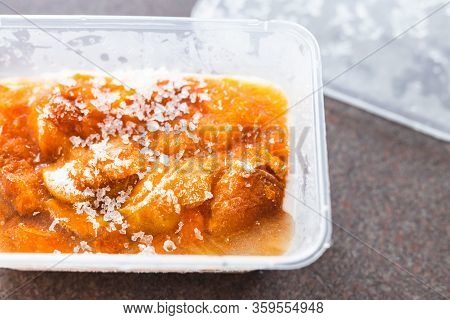Preserving Fresh Produce, Frozen Apricots In Plastic Container With Ice On Top